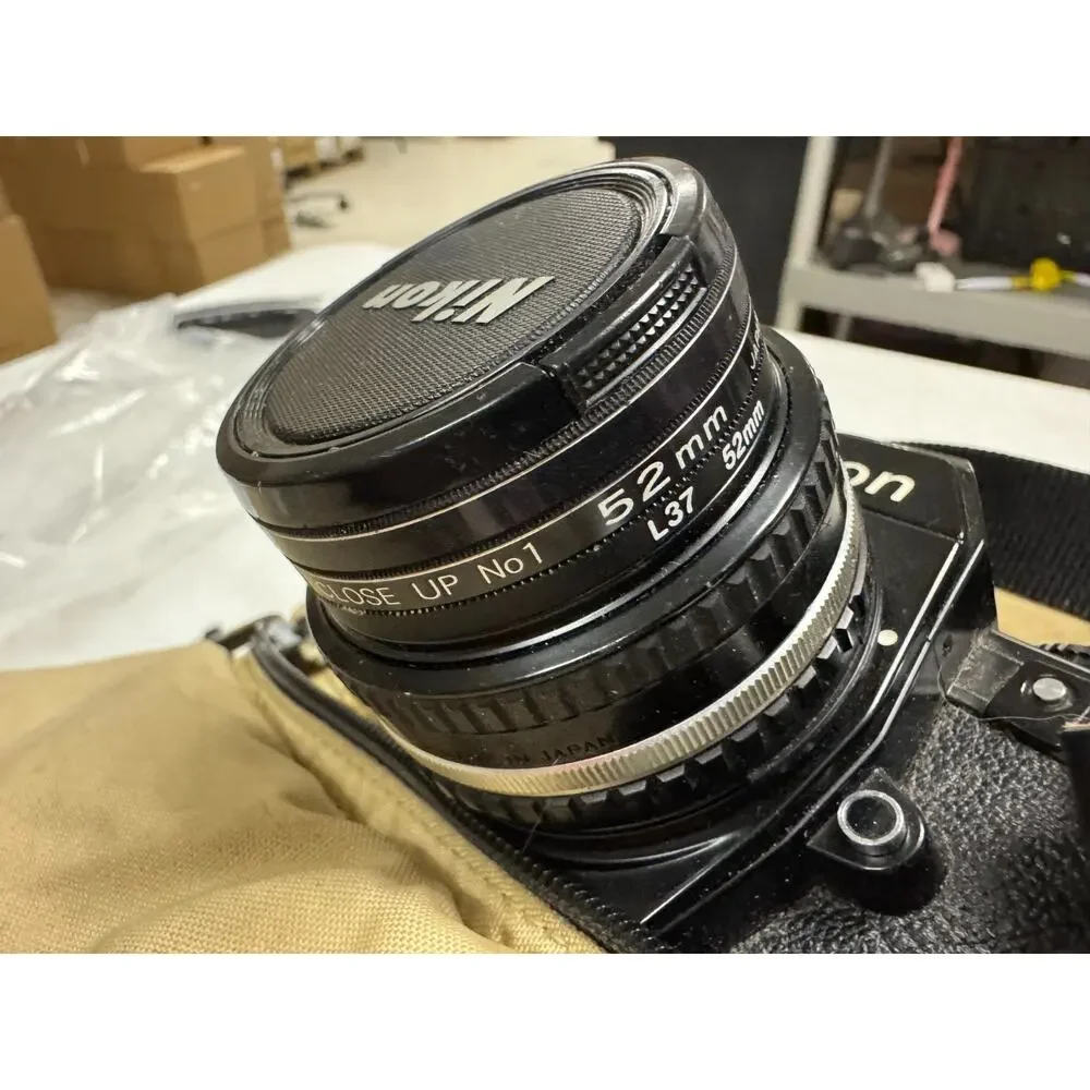 Nikon EM 35mm SLR Film Camera With 50mm Lens Plus 52mm Filter & Extra Lens & Bag